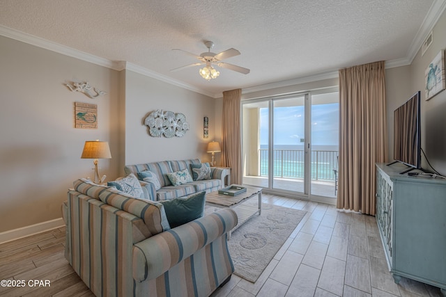 10625 Front Beach Rd Unit 1102, Panama City Beach, FL 32407 - living area with ceiling fan, a textured ceiling, ornamental molding, and light wood-type flooring