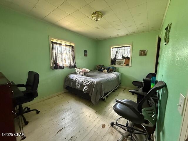 2735 E 12th St, Panama City, FL 32401 - bedroom with hardwood / wood-style floors and baseboards