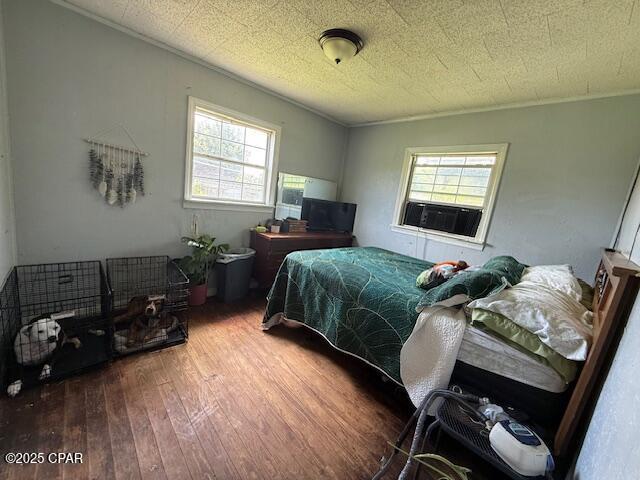 2735 E 12th St, Panama City, FL 32401 - bedroom featuring hardwood / wood-style flooring and cooling unit