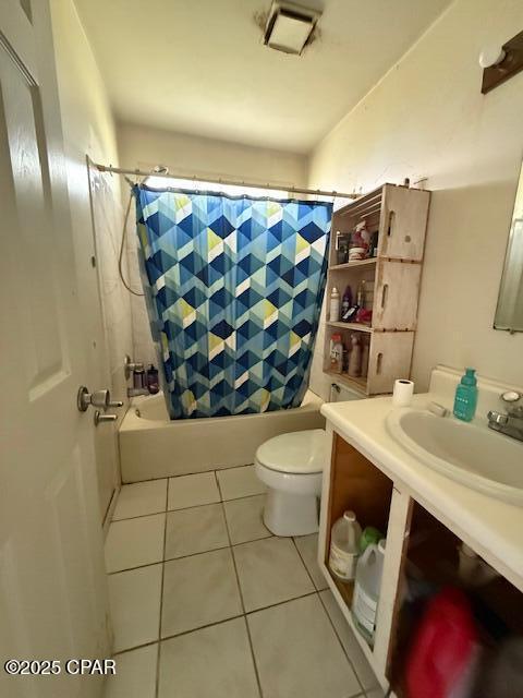 2735 E 12th St, Panama City, FL 32401 - bathroom featuring shower / bathtub combination with curtain, vanity, and tile patterned floors