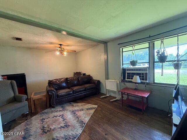2735 E 12th St, Panama City, FL 32401 - living area with wood finished floors, a ceiling fan, and cooling unit