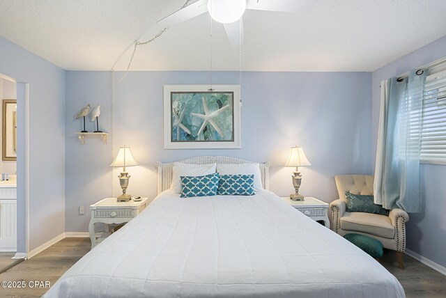 8743 Thomas Dr Unit 928, Panama City Beach, FL 32408 - bedroom with wood finished floors and ceiling fan