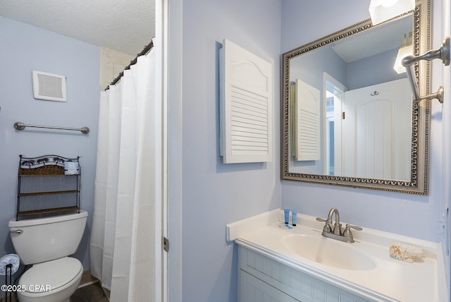 8743 Thomas Dr Unit 928, Panama City Beach, FL 32408 - bathroom featuring vanity, a textured ceiling, and curtained shower