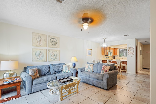 17620 Front Beach Rd Unit 4U, Panama City Beach, FL 32413 - living area with a ceiling fan, light tile patterned floors, and a textured ceiling