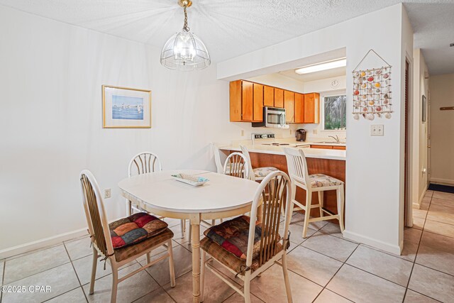 17620 Front Beach Rd Unit 4U, Panama City Beach, FL 32413 - dining space featuring light tile patterned floors and a chandelier
