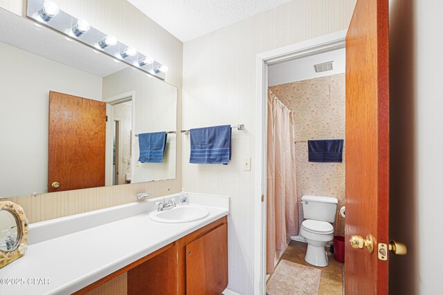 17620 Front Beach Rd Unit 4U, Panama City Beach, FL 32413 - full bathroom featuring wallpapered walls, vanity, and curtained shower