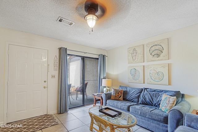 17620 Front Beach Rd Unit 4U, Panama City Beach, FL 32413 - living area with light tile patterned floors, a textured ceiling, and a ceiling fan