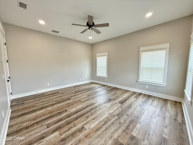 3391 Grey Oak Way, Marianna, FL 32446 - spare room with ceiling fan, wood finished floors, and recessed lighting