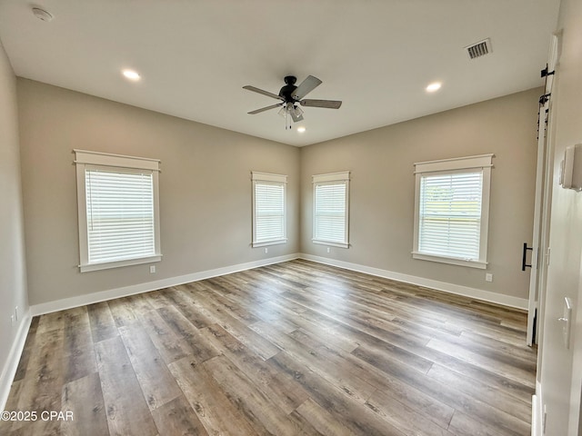 3391 Grey Oak Way, Marianna, FL 32446 - empty room featuring a smoke detector, a ceiling fan, wood finished floors, and recessed lighting