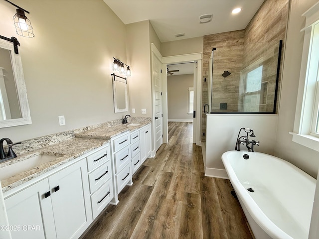 3391 Grey Oak Way, Marianna, FL 32446 - full bathroom with a shower stall, double vanity, a freestanding bath, and healthy amount of natural light