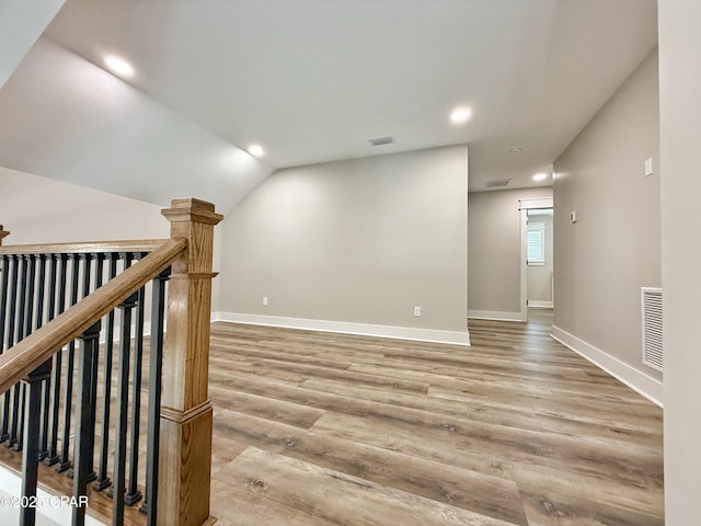 3391 Grey Oak Way, Marianna, FL 32446 - corridor with an upstairs landing, recessed lighting, light wood-style floors, and lofted ceiling