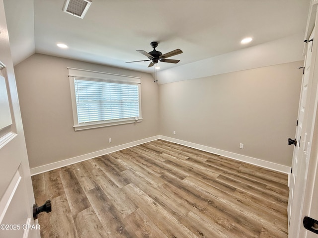 3391 Grey Oak Way, Marianna, FL 32446 - spare room featuring vaulted ceiling, a ceiling fan, wood finished floors, and recessed lighting