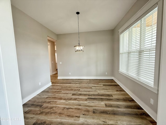 3391 Grey Oak Way, Marianna, FL 32446 - unfurnished dining area with a chandelier and wood finished floors
