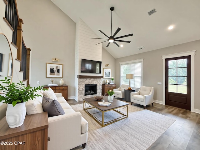 3391 Grey Oak Way, Marianna, FL 32446 - living area with a ceiling fan, high vaulted ceiling, a stone fireplace, wood finished floors, and recessed lighting