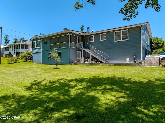1016 Morgan Ave, Chattahoochee, FL 32324 - back of property featuring a sunroom, stairway, and a yard