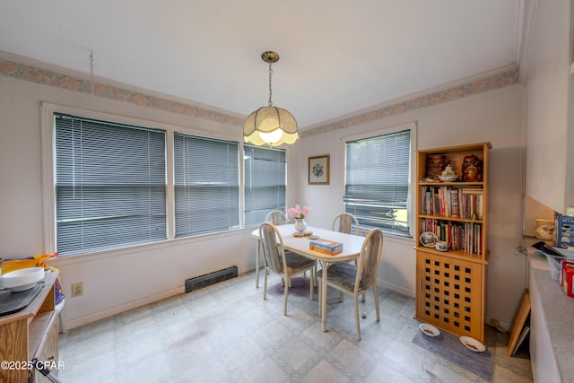 1016 Morgan Ave, Chattahoochee, FL 32324 - dining area featuring tile patterned floors and ornamental molding