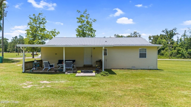 3483 Kynesville Rd, Marianna, FL 32448 - rear view of property with a lawn and a metal roof