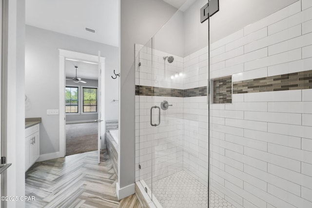 3033 Osprey Cir, Panama City, FL 32405 - full bath with a shower stall, ceiling fan, a bath, and vanity