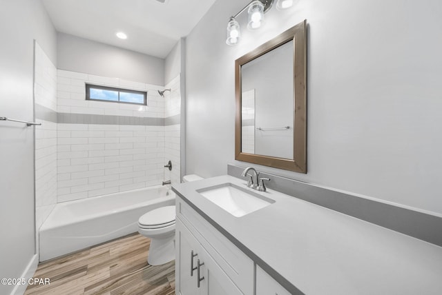 3033 Osprey Cir, Panama City, FL 32405 - bathroom with vanity, wood finished floors, and shower / washtub combination