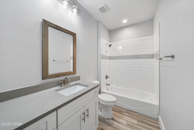 3033 Osprey Cir, Panama City, FL 32405 - bathroom with vanity, wood finished floors, and bathtub / shower combination