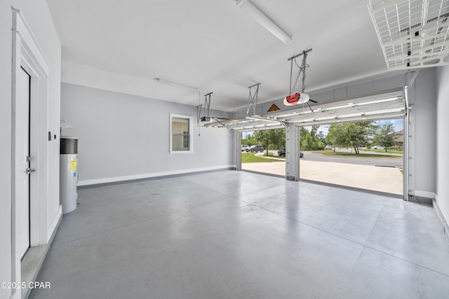 3033 Osprey Cir, Panama City, FL 32405 - garage featuring baseboards and a garage door opener