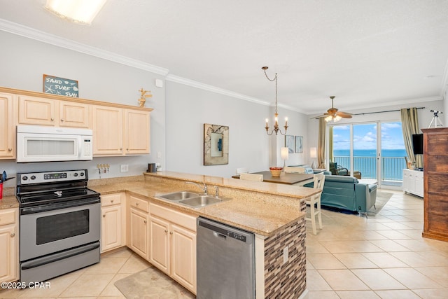 10625 Front Beach Rd Unit 1902, Panama City Beach, FL 32407 - kitchen featuring stainless steel appliances, ornamental molding, light tile patterned floors, a peninsula, and open floor plan