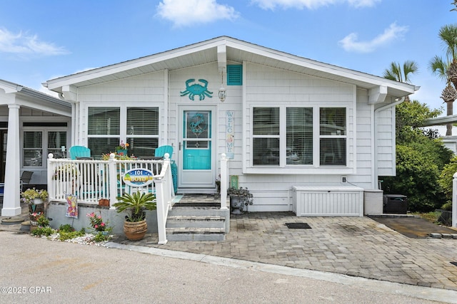 101 Gulf Loop, Panama City Beach, FL 32408 - view of front of home with a porch
