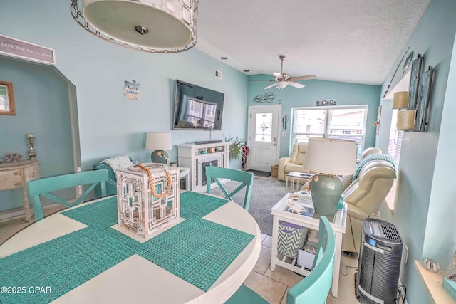 101 Gulf Loop, Panama City Beach, FL 32408 - dining area with lofted ceiling, a ceiling fan, and tile patterned flooring