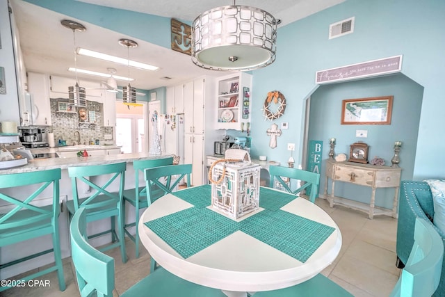 101 Gulf Loop, Panama City Beach, FL 32408 - dining area with light tile patterned floors