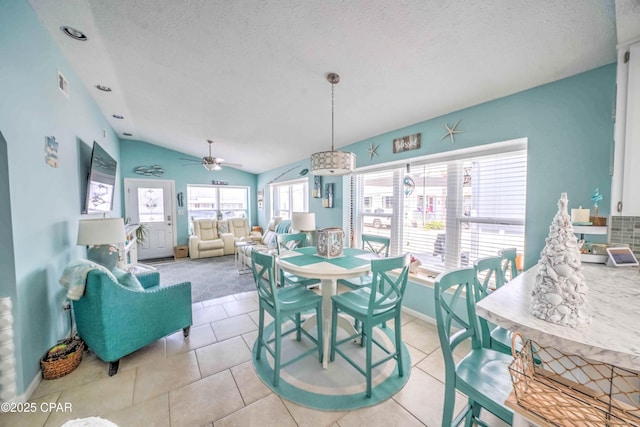 101 Gulf Loop, Panama City Beach, FL 32408 - tiled dining area featuring a textured ceiling, lofted ceiling, and ceiling fan