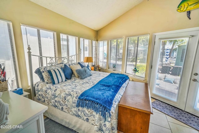 101 Gulf Loop, Panama City Beach, FL 32408 - bedroom featuring vaulted ceiling, access to outside, tile patterned floors, and a textured ceiling