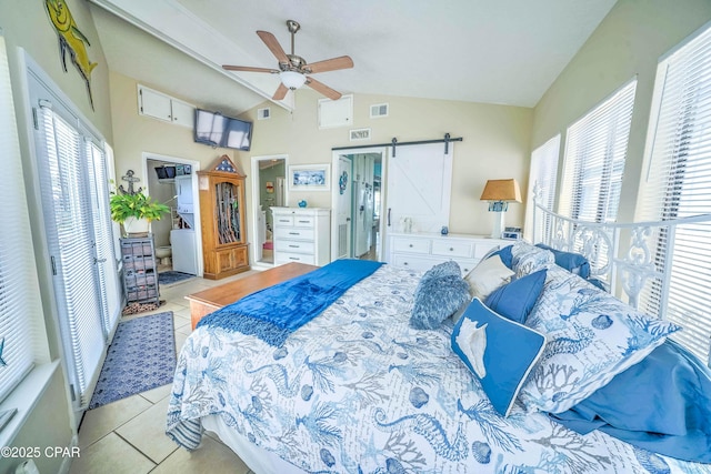 101 Gulf Loop, Panama City Beach, FL 32408 - bedroom featuring light tile patterned floors, a barn door, lofted ceiling, and ceiling fan