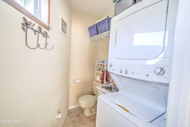 101 Gulf Loop, Panama City Beach, FL 32408 - bathroom with stacked washing machine and dryer and tile patterned floors