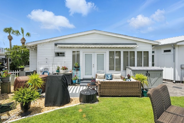 101 Gulf Loop, Panama City Beach, FL 32408 - back of property with french doors, an outdoor hangout area, a patio area, and a yard