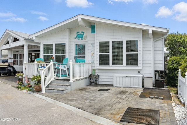 101 Gulf Loop, Panama City Beach, FL 32408 - view of front facade with a porch