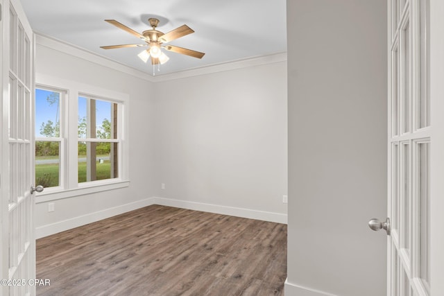 902 Captain Way, Panama City, FL 32404 - unfurnished room featuring a ceiling fan, crown molding, and wood finished floors