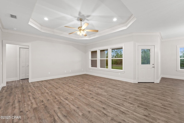 902 Captain Way, Panama City, FL 32404 - empty room with crown molding, a tray ceiling, a ceiling fan, wood finished floors, and recessed lighting