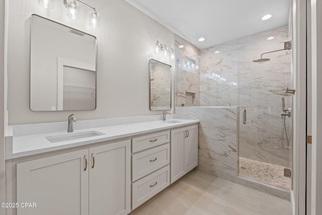 902 Captain Way, Panama City, FL 32404 - bathroom with a marble finish shower, double vanity, and recessed lighting