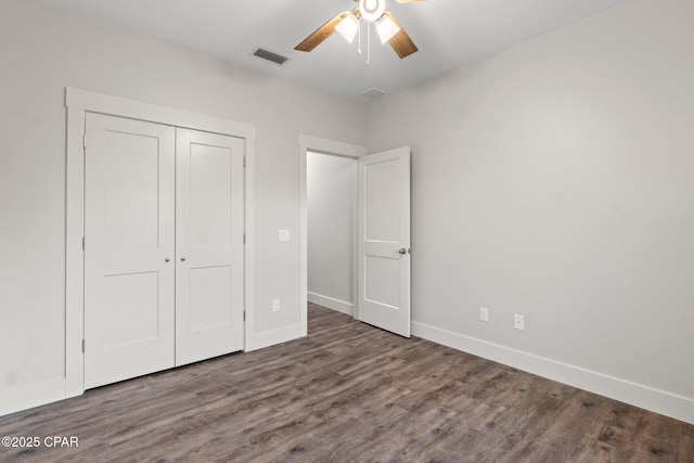 902 Captain Way, Panama City, FL 32404 - unfurnished bedroom with wood finished floors, a closet, and ceiling fan