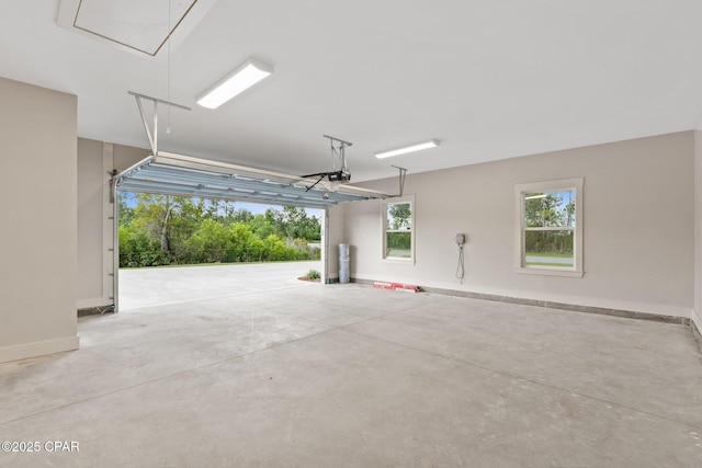 902 Captain Way, Panama City, FL 32404 - garage featuring baseboards and a garage door opener
