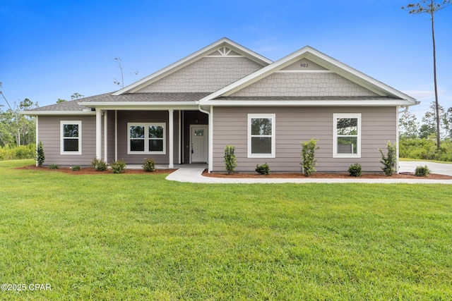 902 Captain Way, Panama City, FL 32404 - craftsman house with a front yard and roof with shingles