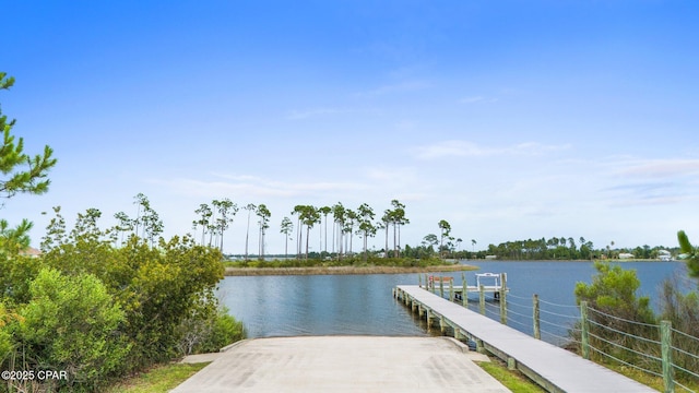 902 Captain Way, Panama City, FL 32404 - dock featuring a boat ramp and a water view