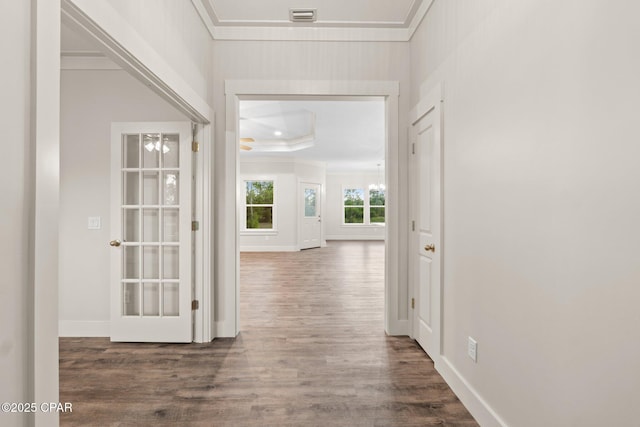 902 Captain Way, Panama City, FL 32404 - hall featuring ornamental molding, wood finished floors, and a tray ceiling