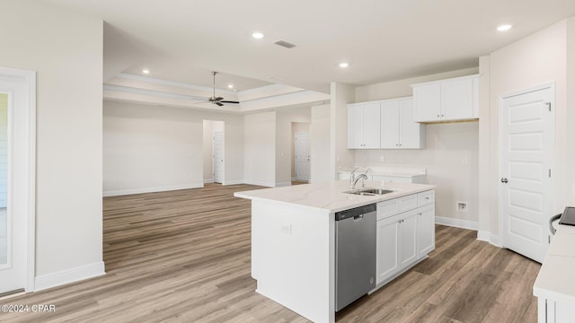 4866 Windrow Way, Panama City, FL 32404 - kitchen featuring stainless steel dishwasher, ceiling fan, light wood-type flooring, a center island with sink, and white cabinets