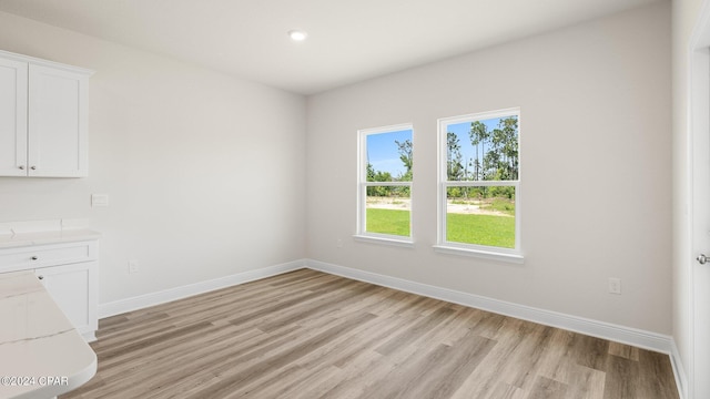4866 Windrow Way, Panama City, FL 32404 - unfurnished dining area featuring light wood-style floors and recessed lighting