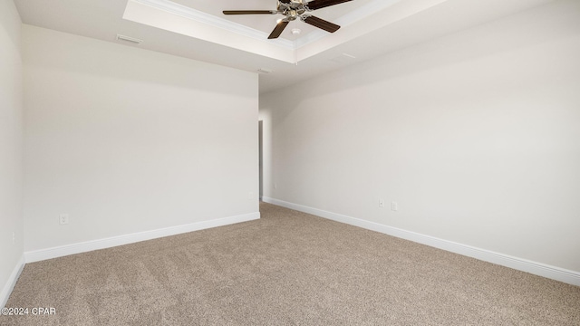 4866 Windrow Way, Panama City, FL 32404 - spare room with a tray ceiling, light colored carpet, a ceiling fan, and crown molding