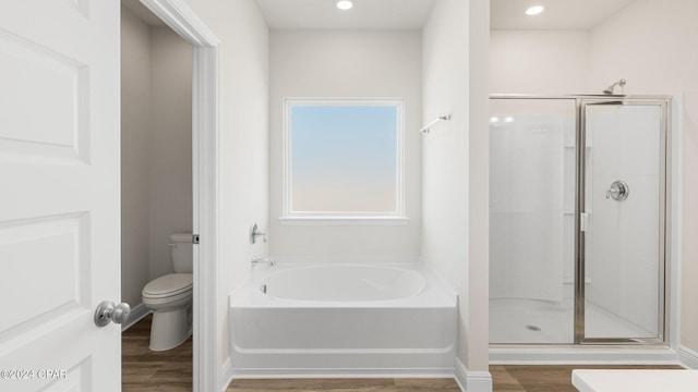 4866 Windrow Way, Panama City, FL 32404 - bathroom featuring wood finished floors, a garden tub, a shower stall, and recessed lighting