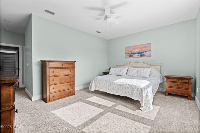 8422 Resota Beach Rd, Southport, FL 32409 - bedroom with light carpet and a ceiling fan