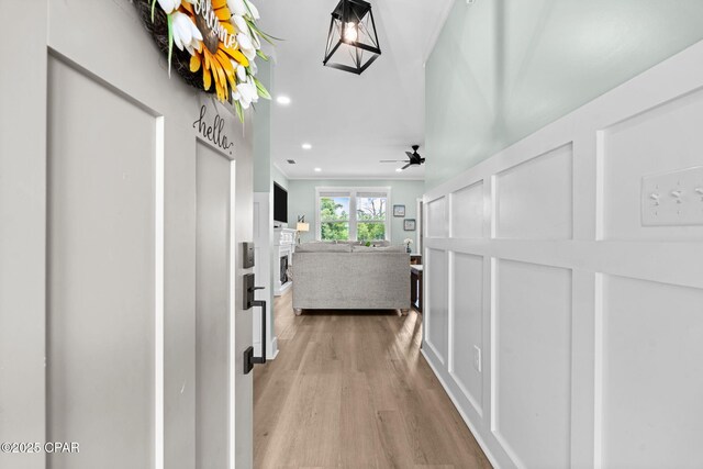 8422 Resota Beach Rd, Southport, FL 32409 - corridor featuring light wood finished floors and recessed lighting