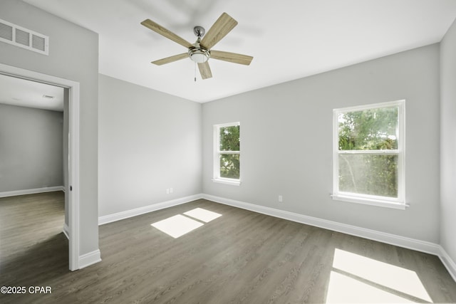 237 Mosaic Dr Unit 42, Port St Joe, FL 32456 - unfurnished bedroom with dark wood finished floors and ceiling fan